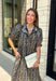 From weekend brunches to family gatherings, this floral midi dress is one you'll be reaching for all season long. Designed in a soft ecru hue with a beautiful floral print, this feminine silhouette is elevated with delicate eyelet lace embroidery throughout for an extra touch of texture and charm. The ruffle neckline, puff sleeves, and tiered ruffle hem create a timeless look, while side pockets make it as practical as it is pretty. 