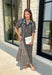 From weekend brunches to family gatherings, this floral midi dress is one you'll be reaching for all season long. Designed in a soft ecru hue with a beautiful floral print, this feminine silhouette is elevated with delicate eyelet lace embroidery throughout for an extra touch of texture and charm. The ruffle neckline, puff sleeves, and tiered ruffle hem create a timeless look, while side pockets make it as practical as it is pretty. 