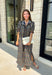 From weekend brunches to family gatherings, this floral midi dress is one you'll be reaching for all season long. Designed in a soft ecru hue with a beautiful floral print, this feminine silhouette is elevated with delicate eyelet lace embroidery throughout for an extra touch of texture and charm. The ruffle neckline, puff sleeves, and tiered ruffle hem create a timeless look, while side pockets make it as practical as it is pretty. 