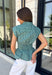 Classic stripes and flattering details make this sleeveless blouse an effortless favorite for fall! Featuring rich hunter green and light blue stripes, and hunter green polka dots, this timeless top is designed with a flattering v-neckline and an adjustable self-tie waist that creates a beautifully defined silhouette. The button front adds a polished finish, while the smocked elastic back offers all-day comfort and the perfect fit. 