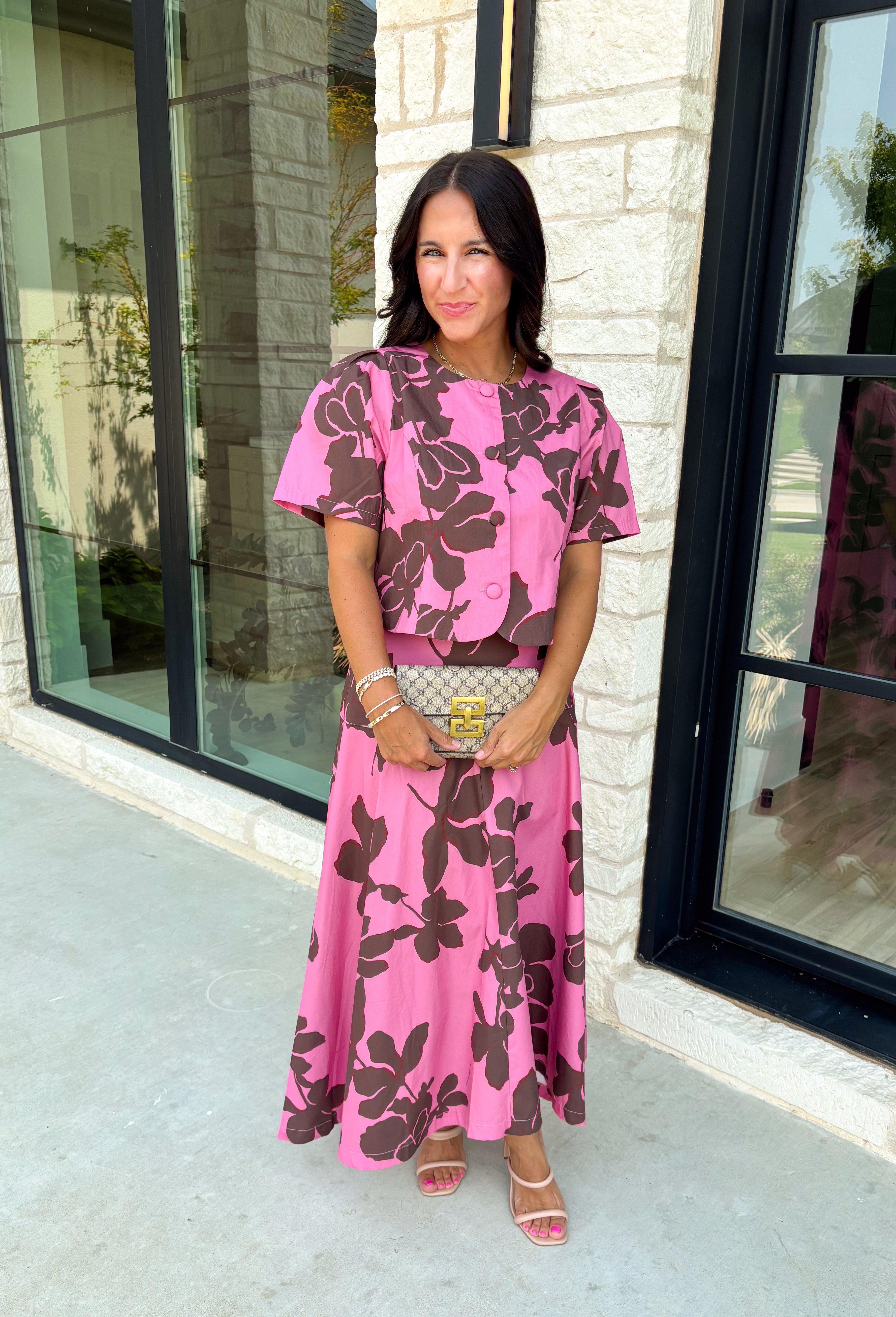 Add a fresh pop of color to your fall wardrobe with this charming floral top that's as versatile as it is pretty! Designed in a beautiful pink hue with a rich brown floral print, this lightweight cotton blouse brings the perfect blend of feminine style and everyday comfort. Wear it with the coordinating skirt for an effortlessly polished matching set, or style it on its own with your favorite denim or trousers for endless outfit possibilities.