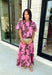 Add a fresh pop of color to your fall wardrobe with this charming floral top that's as versatile as it is pretty! Designed in a beautiful pink hue with a rich brown floral print, this lightweight cotton blouse brings the perfect blend of feminine style and everyday comfort. Wear it with the coordinating skirt for an effortlessly polished matching set, or style it on its own with your favorite denim or trousers for endless outfit possibilities.