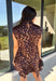 Leopard gets a dressed-up update with this satin dress from THML. The smooth satin fabric gives the classic animal print a little extra shine, making it a fun choice as fall events start giving way to holiday parties and seasonal celebrations. A draped mock neckline creates a flattering focal point, while the short sleeves keep the silhouette simple and easy to accessorize. A keyhole closure at the back adds a pretty finishing detail, and the fully lined design provides comfortable coverage. 