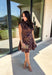 Leopard gets a dressed-up update with this satin dress from THML. The smooth satin fabric gives the classic animal print a little extra shine, making it a fun choice as fall events start giving way to holiday parties and seasonal celebrations. A draped mock neckline creates a flattering focal point, while the short sleeves keep the silhouette simple and easy to accessorize. A keyhole closure at the back adds a pretty finishing detail, and the fully lined design provides comfortable coverage. 