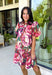 Rich color and feminine details make this floral dress a standout for the season. Designed in a gorgeous wine hue with a beautiful floral print, this dress is effortlessly charming from every angle. The button-front design, soft puff sleeves, and flirty ruffle hem create a timeless silhouette, while the lightweight cotton fabric and fully lined construction keep it comfortable for all-day wear. 
