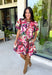 Rich color and feminine details make this floral dress a standout for the season. Designed in a gorgeous wine hue with a beautiful floral print, this dress is effortlessly charming from every angle. The button-front design, soft puff sleeves, and flirty ruffle hem create a timeless silhouette, while the lightweight cotton fabric and fully lined construction keep it comfortable for all-day wear. 