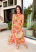 This pink botanical midi dress is such a fresh and vibrant pick for summer! The colorful print adds the perfect pop of personality, while the mock neckline gives it a slightly elevated, polished feel. Designed with a smocked back waist, it offers a flattering and comfortable fit that moves with you throughout the day. Fully lined and made from breathable cotton, it’s perfect for everything from brunch to special events. The button-loop closure at the back adds a delicate finishing touch. 