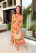 This pink botanical midi dress is such a fresh and vibrant pick for summer! The colorful print adds the perfect pop of personality, while the mock neckline gives it a slightly elevated, polished feel. Designed with a smocked back waist, it offers a flattering and comfortable fit that moves with you throughout the day. Fully lined and made from breathable cotton, it’s perfect for everything from brunch to special events. The button-loop closure at the back adds a delicate finishing touch. 