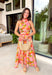 This pink botanical midi dress is such a fresh and vibrant pick for summer! The colorful print adds the perfect pop of personality, while the mock neckline gives it a slightly elevated, polished feel. Designed with a smocked back waist, it offers a flattering and comfortable fit that moves with you throughout the day. Fully lined and made from breathable cotton, it’s perfect for everything from brunch to special events. The button-loop closure at the back adds a delicate finishing touch. 
