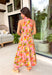This pink botanical midi dress is such a fresh and vibrant pick for summer! The colorful print adds the perfect pop of personality, while the mock neckline gives it a slightly elevated, polished feel. Designed with a smocked back waist, it offers a flattering and comfortable fit that moves with you throughout the day. Fully lined and made from breathable cotton, it’s perfect for everything from brunch to special events. The button-loop closure at the back adds a delicate finishing touch. 
