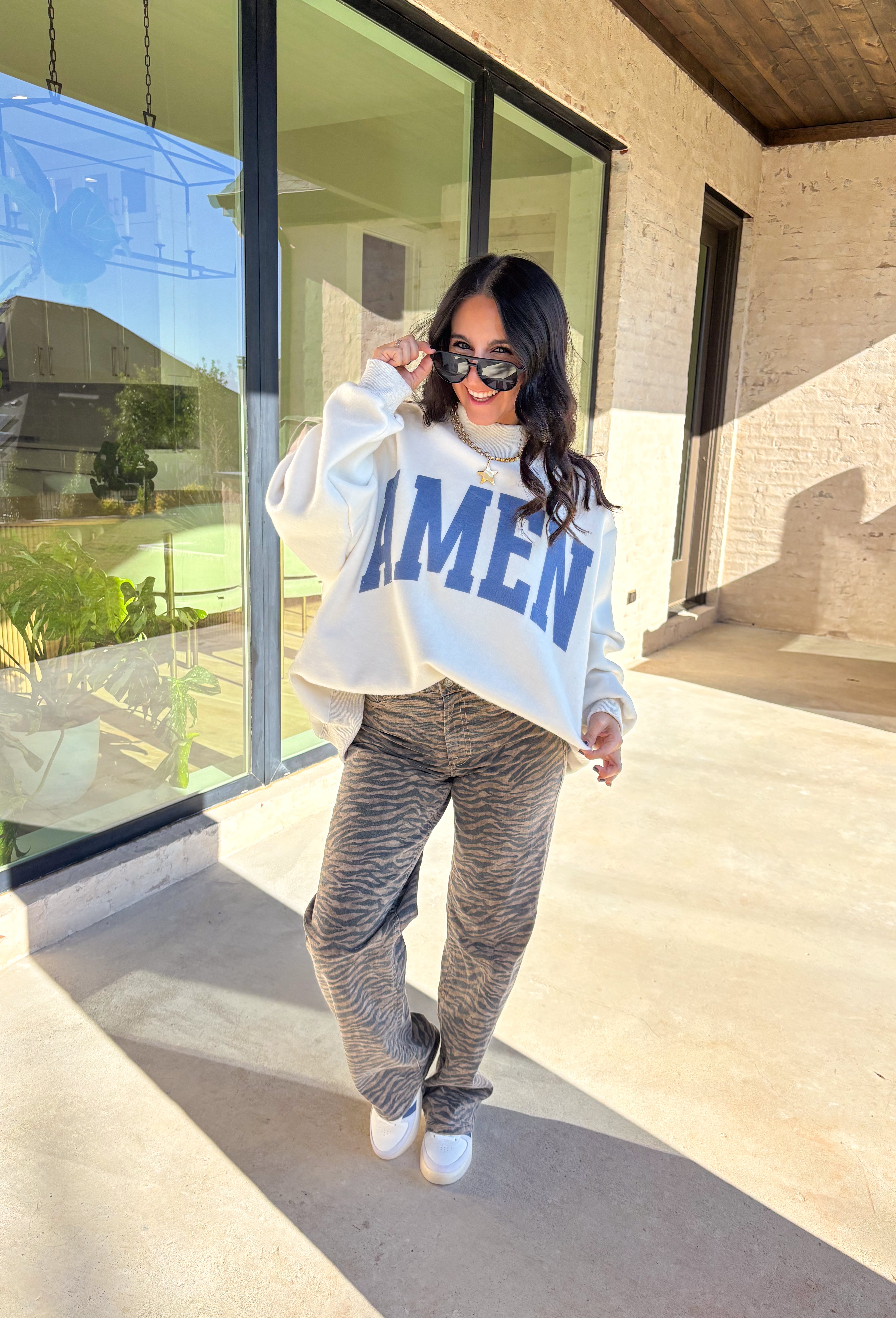 This pullover is giving cozy Sunday vibes — whether you’re headed to church, coffee with a friend, or just lounging with your fam. The reversible design makes it twice as good (literally!). One side reads “WWJD” and the other says “Amen,” so you can wear your faith however you’re feeling that day. Soft, warm, and made for chill fall moments, this one’s bound to be on repeat all season long!