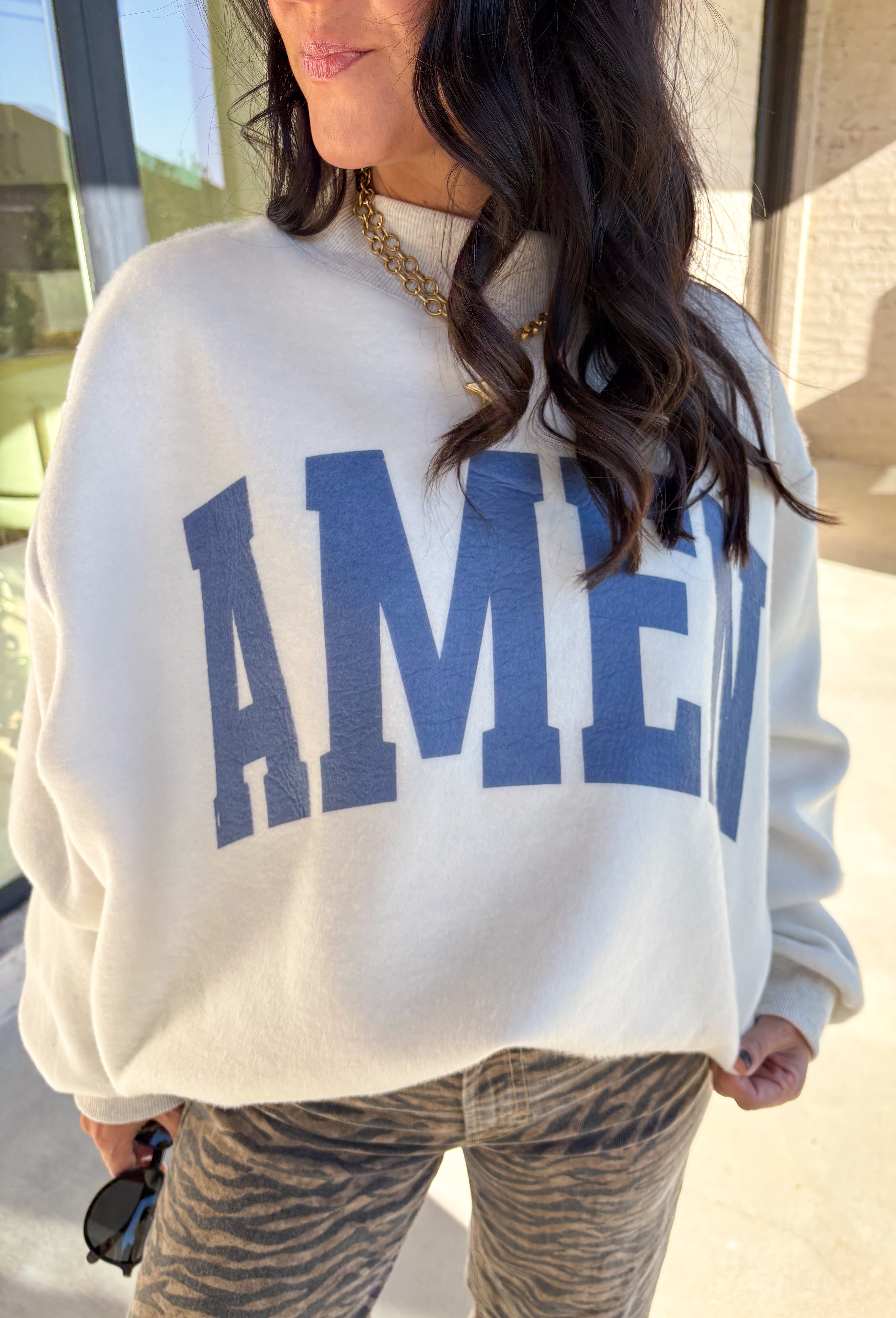 This pullover is giving cozy Sunday vibes — whether you’re headed to church, coffee with a friend, or just lounging with your fam. The reversible design makes it twice as good (literally!). One side reads “WWJD” and the other says “Amen,” so you can wear your faith however you’re feeling that day. Soft, warm, and made for chill fall moments, this one’s bound to be on repeat all season long!