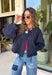 Meet the lightweight jacket you'll be reaching for all season long. Designed in a versatile navy hue, this timeless layering piece combines effortless style with everyday functionality. The button-front design and adjustable drawstring waist create a flattering, customizable fit, while the front pockets add the perfect finishing touch for keeping your essentials close. 