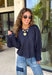 Meet the lightweight jacket you'll be reaching for all season long. Designed in a versatile navy hue, this timeless layering piece combines effortless style with everyday functionality. The button-front design and adjustable drawstring waist create a flattering, customizable fit, while the front pockets add the perfect finishing touch for keeping your essentials close. 