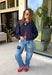 Meet the lightweight jacket you'll be reaching for all season long. Designed in a versatile navy hue, this timeless layering piece combines effortless style with everyday functionality. The button-front design and adjustable drawstring waist create a flattering, customizable fit, while the front pockets add the perfect finishing touch for keeping your essentials close. 