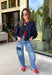 Meet the lightweight jacket you'll be reaching for all season long. Designed in a versatile navy hue, this timeless layering piece combines effortless style with everyday functionality. The button-front design and adjustable drawstring waist create a flattering, customizable fit, while the front pockets add the perfect finishing touch for keeping your essentials close. 