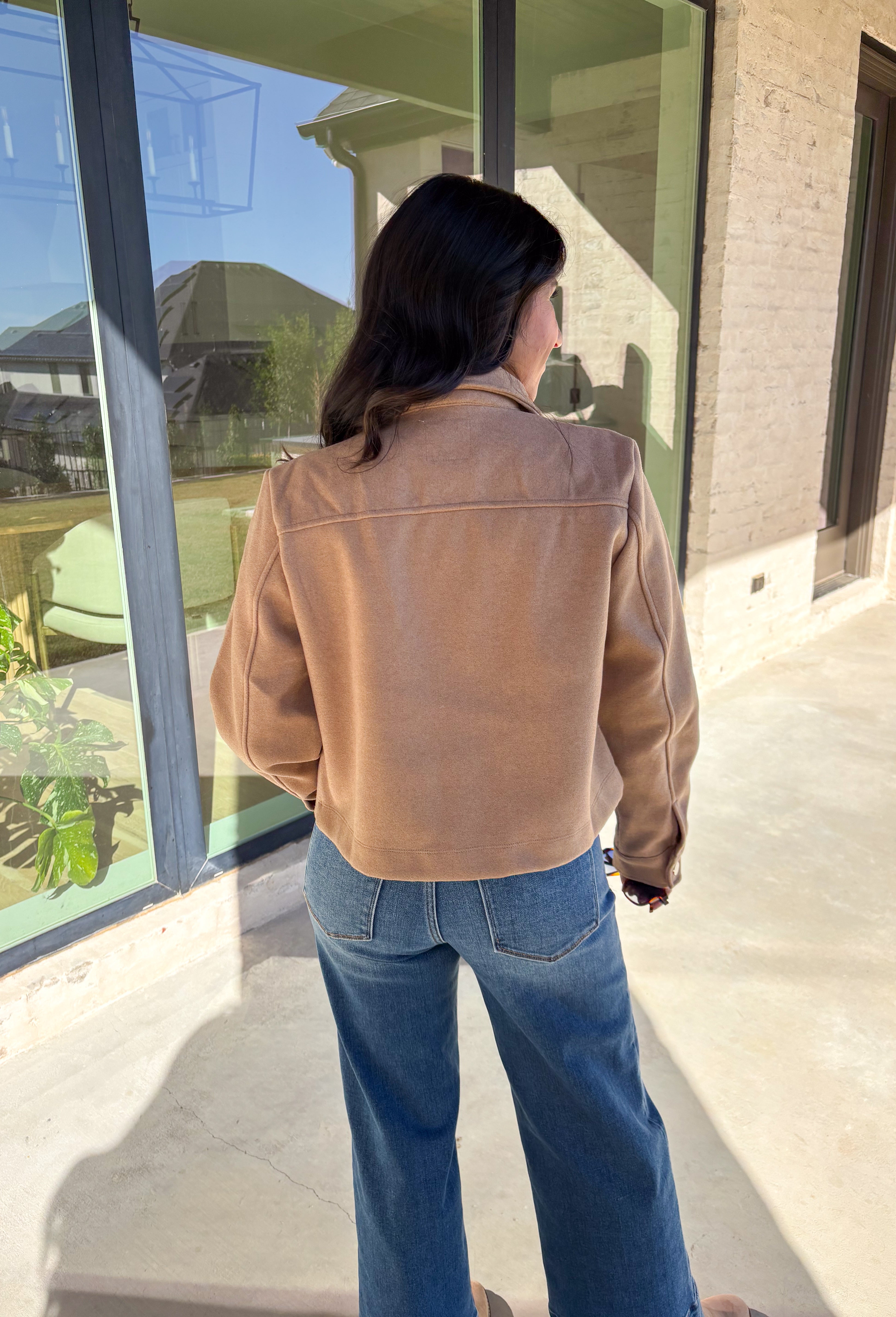 A timeless staple with everyday versatility, this light taupe jacket by Blashe is perfect for layering through the season. Designed with a collared neckline, silver snap button closures, and two front pockets, it balances utility with modern style. Lightweight yet cozy, it’s an easy throw-on piece that works just as well over dresses as it does with denim.