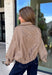 Classic gingham gets a fun fall refresh with this camel and cream jacket from Glam. The neutral checkered print keeps it easy to style, while sequin stitching throughout adds just the right amount of sparkle when it catches the light. A collared neckline and both zipper and button closures give it a structured, jacket-inspired look, while the elastic back hem creates a comfortable shape.