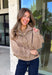 Classic gingham gets a fun fall refresh with this camel and cream jacket from Glam. The neutral checkered print keeps it easy to style, while sequin stitching throughout adds just the right amount of sparkle when it catches the light. A collared neckline and both zipper and button closures give it a structured, jacket-inspired look, while the elastic back hem creates a comfortable shape.