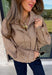 Classic gingham gets a fun fall refresh with this camel and cream jacket from Glam. The neutral checkered print keeps it easy to style, while sequin stitching throughout adds just the right amount of sparkle when it catches the light. A collared neckline and both zipper and button closures give it a structured, jacket-inspired look, while the elastic back hem creates a comfortable shape.