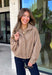 Classic gingham gets a fun fall refresh with this camel and cream jacket from Glam. The neutral checkered print keeps it easy to style, while sequin stitching throughout adds just the right amount of sparkle when it catches the light. A collared neckline and both zipper and button closures give it a structured, jacket-inspired look, while the elastic back hem creates a comfortable shape.