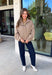 Classic gingham gets a fun fall refresh with this camel and cream jacket from Glam. The neutral checkered print keeps it easy to style, while sequin stitching throughout adds just the right amount of sparkle when it catches the light. A collared neckline and both zipper and button closures give it a structured, jacket-inspired look, while the elastic back hem creates a comfortable shape.