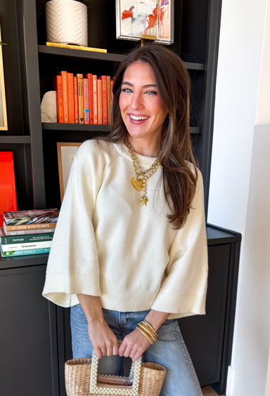 Soft, cozy, and perfect for transitional spring days, this cream sweater knit top by Entro is an easy wardrobe staple. Designed with raglan ¾ length sleeves, it has a relaxed, flattering fit that feels comfortable without being bulky. Ribbed detailing at the neckline, cuffs, and hem adds subtle texture and a polished finish, while the medium-weight knit makes it ideal for cool mornings and breezy afternoons.