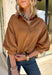 Elevate your everyday wardrobe with this effortlessly polished faux suede top from Day + Moon. Designed in a warm camel hue, this timeless button-down blouse is the perfect blend of classic style and seasonal charm. The collared neckline gives it a refined look, while the soft balloon sleeves add just the right amount of feminine flair. Crafted from buttery-soft faux suede, this versatile top easily transitions from the office to weekend outings, making it a staple you'll reach for all fall long.