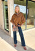 Elevate your everyday wardrobe with this effortlessly polished faux suede top from Day + Moon. Designed in a warm camel hue, this timeless button-down blouse is the perfect blend of classic style and seasonal charm. The collared neckline gives it a refined look, while the soft balloon sleeves add just the right amount of feminine flair. Crafted from buttery-soft faux suede, this versatile top easily transitions from the office to weekend outings, making it a staple you'll reach for all fall long.