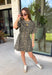 Leopard print is always in style, especially for fall! This olive dress brings together a timeless animal print with an effortlessly flattering silhouette you'll love wearing all season long. The adjustable drawstring waist lets you customize the fit, while the soft fabric keeps it comfortable from morning to night. Finished with short sleeves and everyone's favorite feature—side pockets—this dress is perfect for everything from coffee dates and shopping trips to game days and weekend adventures. 