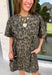 Leopard print is always in style, especially for fall! This olive dress brings together a timeless animal print with an effortlessly flattering silhouette you'll love wearing all season long. The adjustable drawstring waist lets you customize the fit, while the soft fabric keeps it comfortable from morning to night. Finished with short sleeves and everyone's favorite feature—side pockets—this dress is perfect for everything from coffee dates and shopping trips to game days and weekend adventures. 