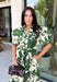 Classic florals and thoughtful details make this midi dress a standout for the season. Designed with a soft cream backdrop and an olive floral print, this beautifully feminine dress is perfect for everything from brunch dates to family gatherings. Delicate pleating along the neckline and collar adds elegant texture, while the matching self-tie belt creates a flattering, customizable silhouette. 
