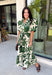 Classic florals and thoughtful details make this midi dress a standout for the season. Designed with a soft cream backdrop and an olive floral print, this beautifully feminine dress is perfect for everything from brunch dates to family gatherings. Delicate pleating along the neckline and collar adds elegant texture, while the matching self-tie belt creates a flattering, customizable silhouette. 