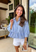 This light blue babydoll top is basically spring in outfit form! With soft pale yellow and white stripes, a classic collared neckline, and a button-down front, it’s the perfect mix of polished and playful. The babydoll silhouette gives you that easy, floaty fit we all love—cute, comfy, and made for sunny days. Finished with a sweet ruffle hem, it’s the kind of top you’ll throw on with denim shorts, white jeans for an effortless, breezy look.