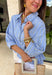This light blue babydoll top is basically spring in outfit form! With soft pale yellow and white stripes, a classic collared neckline, and a button-down front, it’s the perfect mix of polished and playful. The babydoll silhouette gives you that easy, floaty fit we all love—cute, comfy, and made for sunny days. Finished with a sweet ruffle hem, it’s the kind of top you’ll throw on with denim shorts, white jeans for an effortless, breezy look.