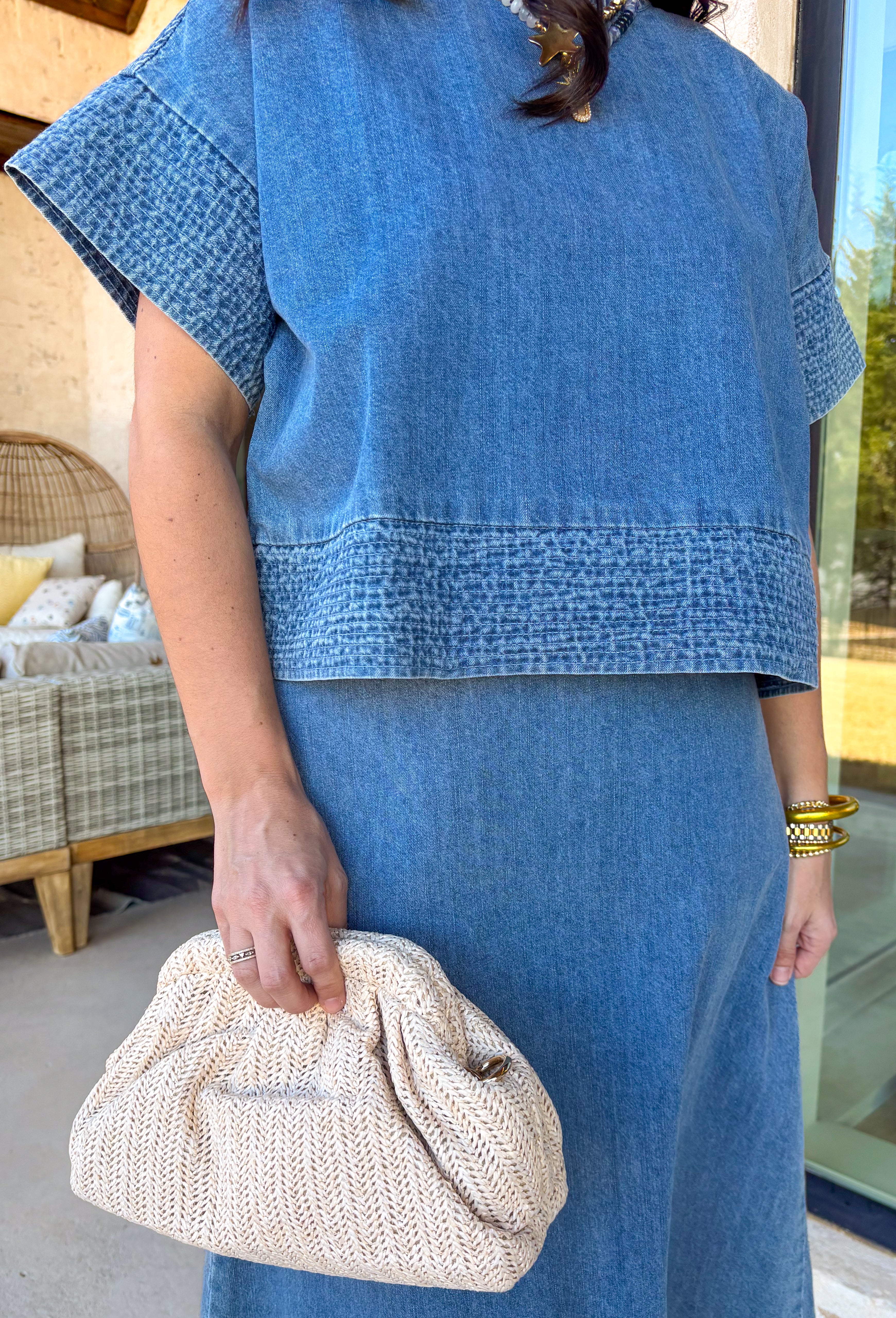 Denim just got a whole lot cuter. This two-piece set by Wishlist is the perfect spring outfit when you want to look put together without overthinking it. The short sleeve denim top pairs perfectly with the matching midi skirt for an effortlessly coordinated look. Embroidered stitching detail along the sleeve cuffs and hem adds a sweet, elevated touch, and the skirt features matching embroidery along the hem for a polished finish. 