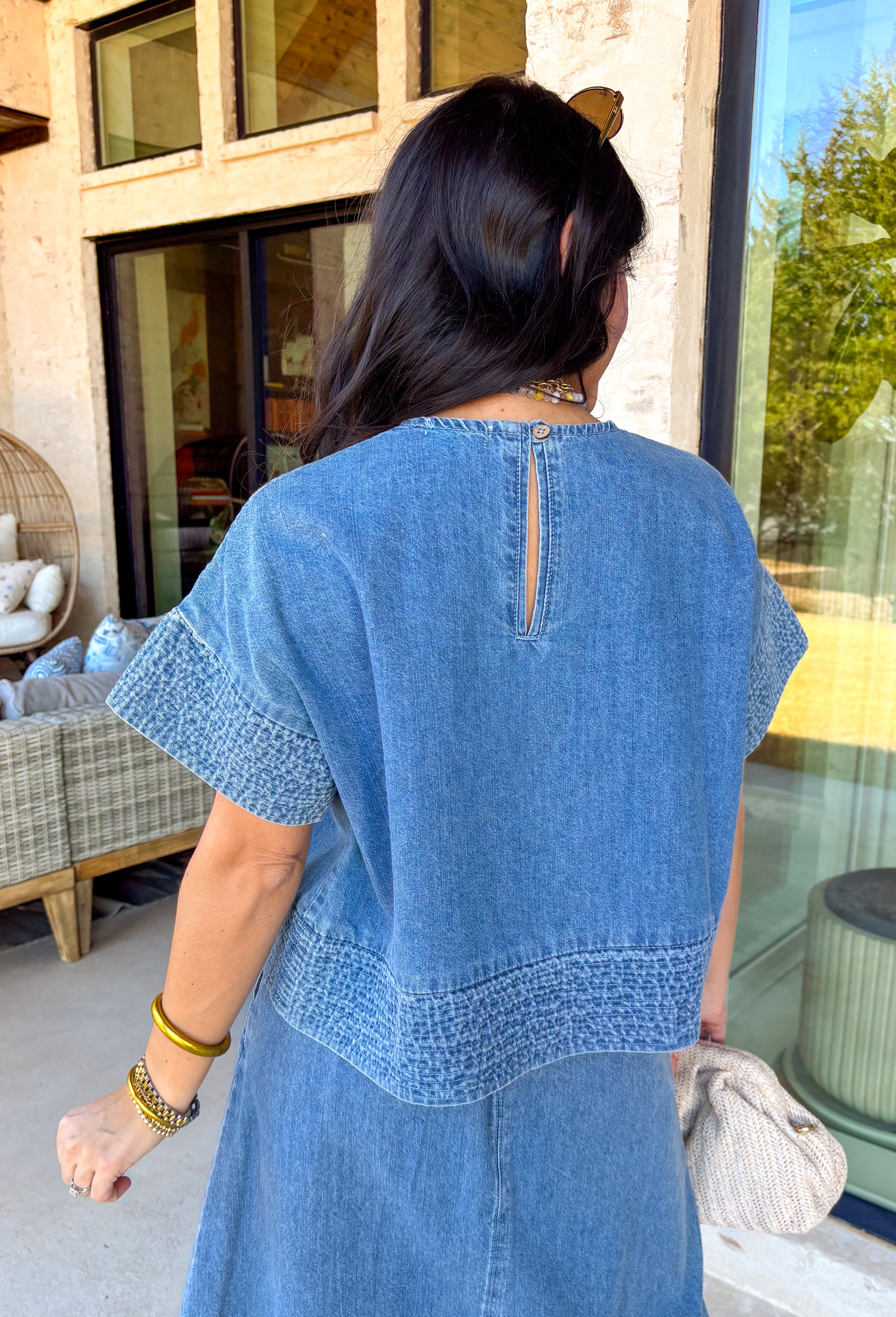 Denim just got a whole lot cuter. This two-piece set by Wishlist is the perfect spring outfit when you want to look put together without overthinking it. The short sleeve denim top pairs perfectly with the matching midi skirt for an effortlessly coordinated look. Embroidered stitching detail along the sleeve cuffs and hem adds a sweet, elevated touch, and the skirt features matching embroidery along the hem for a polished finish. 