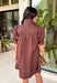 Simple, timeless, and endlessly versatile, this button-front dress is a wardrobe staple you'll reach for all season long. Designed in a rich brown hue, this effortlessly polished dress features a classic button-down front and feminine puff sleeves for the perfect balance of everyday comfort and elevated style. Side pockets add a practical touch, while the breathable cotton fabric keeps it comfortable from morning to night. 