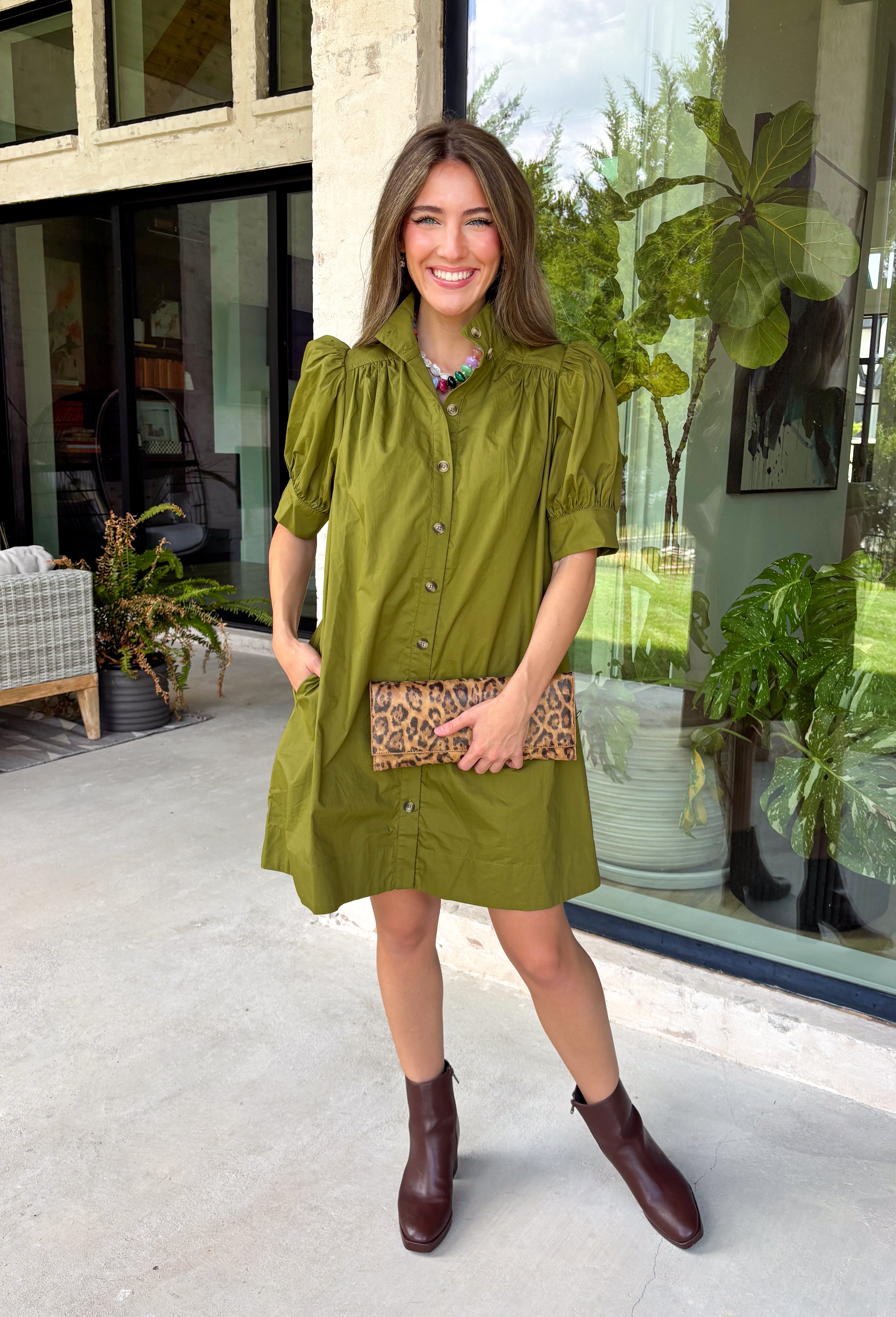 Simple, timeless, and endlessly versatile, this button-front dress is a wardrobe staple you'll reach for all season long. Designed in a olive hue, this effortlessly polished dress features a classic button-down front and feminine puff sleeves for the perfect balance of everyday comfort and elevated style. Side pockets add a practical touch, while the breathable cotton fabric keeps it comfortable from morning to night.