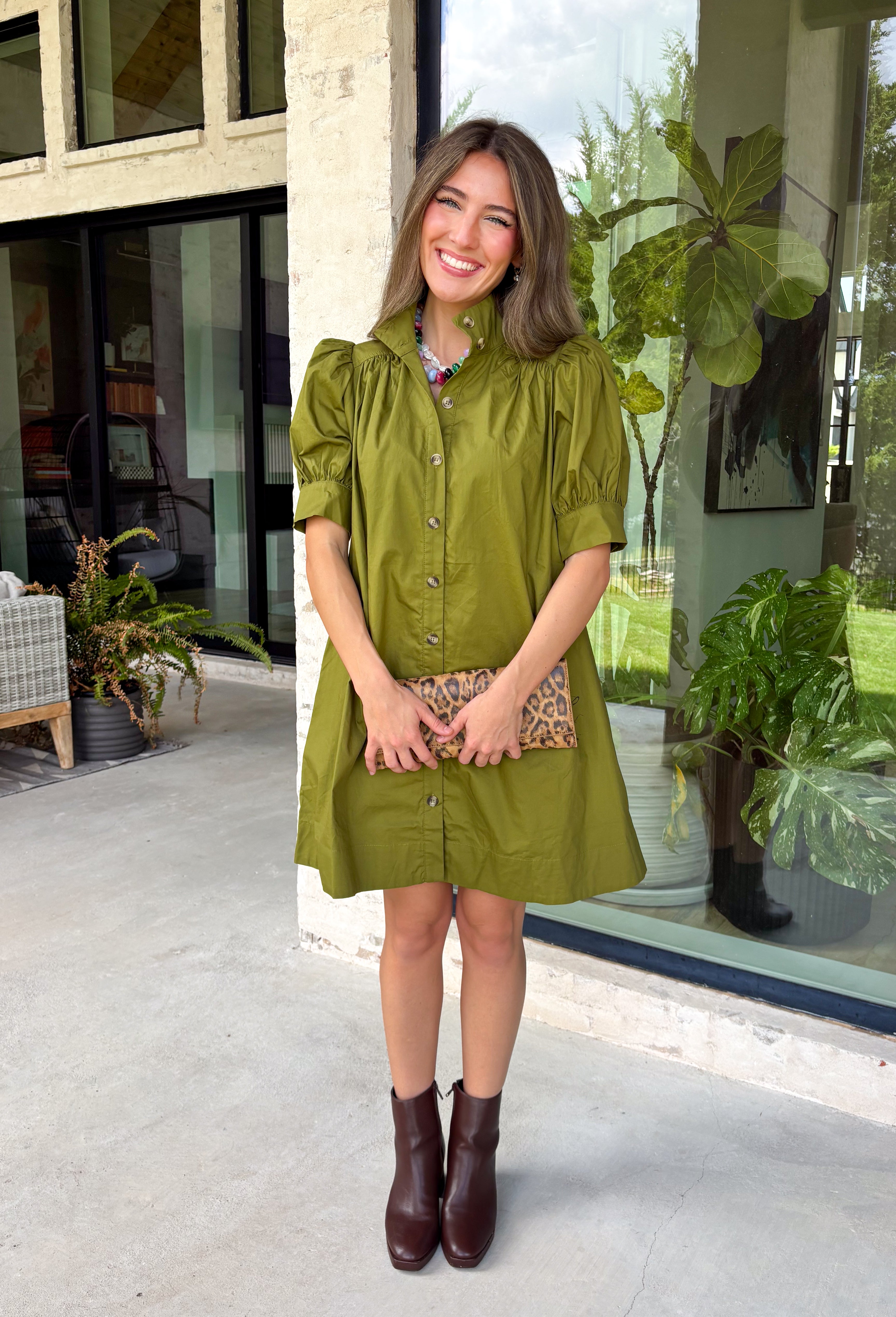 Simple, timeless, and endlessly versatile, this button-front dress is a wardrobe staple you'll reach for all season long. Designed in a olive hue, this effortlessly polished dress features a classic button-down front and feminine puff sleeves for the perfect balance of everyday comfort and elevated style. Side pockets add a practical touch, while the breathable cotton fabric keeps it comfortable from morning to night.