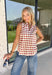 Add a touch of playful charm to your everyday wardrobe with this effortlessly polished sleeveless top from Entro. Featuring a soft ecru backdrop with a rust polka dot print and subtle pops of pink, this lightweight blouse is full of warm seasonal color. The flattering v-neckline keeps the look timeless, while the pleated back detail adds beautiful movement and an easy, flowy fit. 