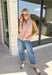 Add a touch of playful charm to your everyday wardrobe with this effortlessly polished sleeveless top from Entro. Featuring a soft ecru backdrop with a rust polka dot print and subtle pops of pink, this lightweight blouse is full of warm seasonal color. The flattering v-neckline keeps the look timeless, while the pleated back detail adds beautiful movement and an easy, flowy fit. 