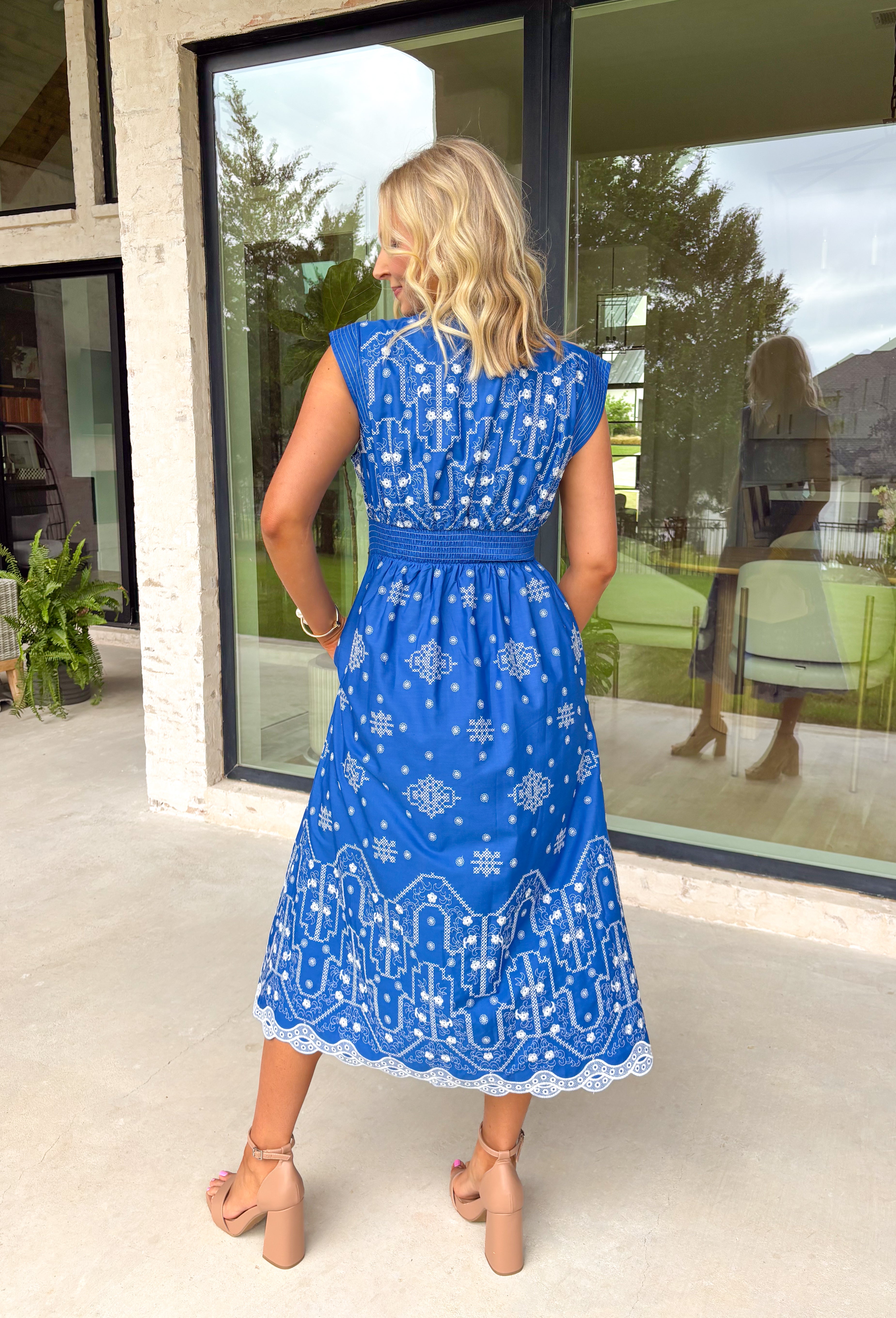 This blue midi dress by Entro is such a fresh, feel-good pick for spring! Featuring a crisp white embroidered print throughout, it has that sweet, elevated look that feels effortless but still a little special. The cap sleeves keep it light and easy, while the front zipper closure adds a modern touch (and makes getting dressed a breeze). Pintuck details at the neckline and waist give it a flattering shape and a polished finish that works for everything from brunch to showers to spring events. 