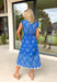 This blue midi dress by Entro is such a fresh, feel-good pick for spring! Featuring a crisp white embroidered print throughout, it has that sweet, elevated look that feels effortless but still a little special. The cap sleeves keep it light and easy, while the front zipper closure adds a modern touch (and makes getting dressed a breeze). Pintuck details at the neckline and waist give it a flattering shape and a polished finish that works for everything from brunch to showers to spring events. 
