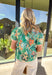 Bright, cheerful, and full of spring energy, this green short sleeve top by Umgee is a fun way to add color to your everyday lineup. Featuring a lively floral print with pops of orange, white, and blue, this top really shines with its contrasting abstract print details along the front, sleeve cuffs, and hem. The mix of patterns and playful colors gives it that effortlessly styled look that feels perfect for sunny days ahead.