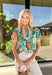 Bright, cheerful, and full of spring energy, this green short sleeve top by Umgee is a fun way to add color to your everyday lineup. Featuring a lively floral print with pops of orange, white, and blue, this top really shines with its contrasting abstract print details along the front, sleeve cuffs, and hem. The mix of patterns and playful colors gives it that effortlessly styled look that feels perfect for sunny days ahead.