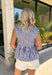 Nothing says effortless spring style quite like navy and white stripes. This classic collared top by Fate gets a fresh update with a flattering front tie detail that adds just the right touch of charm. Crisp yet relaxed, it’s the kind of piece you’ll reach for on sunny mornings, weekend brunch dates, and everything in between. Lightweight and breathable in 100% cotton, this striped beauty pairs perfectly with white denim, cutoffs, or your favorite wide-leg jeans for that easy coastal-inspired look.