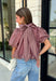 Sweet gingham and thoughtful details make this blouse an instant favorite for the season. Featuring a charming pink and brown gingham print, this lightweight top brings a fresh, feminine touch to your fall wardrobe. The mock neckline with a tie detail at the neck, puff sleeves, and bubble hem create a flattering silhouette that's both polished and comfortable. 
