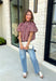 Sweet gingham and thoughtful details make this blouse an instant favorite for the season. Featuring a charming pink and brown gingham print, this lightweight top brings a fresh, feminine touch to your fall wardrobe. The mock neckline with a tie detail at the neck, puff sleeves, and bubble hem create a flattering silhouette that's both polished and comfortable. 