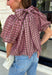 Sweet gingham and thoughtful details make this blouse an instant favorite for the season. Featuring a charming pink and brown gingham print, this lightweight top brings a fresh, feminine touch to your fall wardrobe. The mock neckline with a tie detail at the neck, puff sleeves, and bubble hem create a flattering silhouette that's both polished and comfortable. 